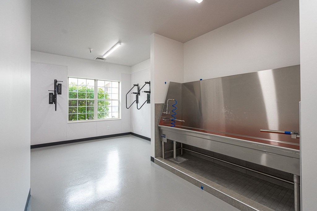 a large room with white walls and a large window